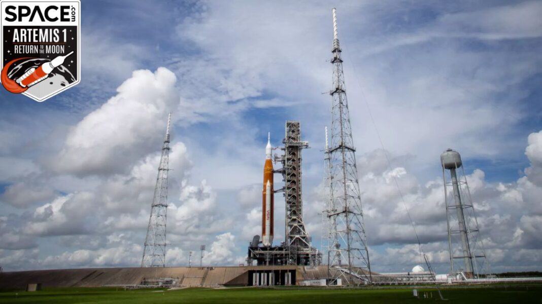 giant space launch system rocket on launch pad and cloudy sky