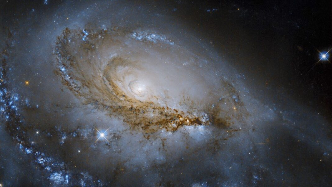 stunning spiral galaxy photo with stars seen by hubble telescope