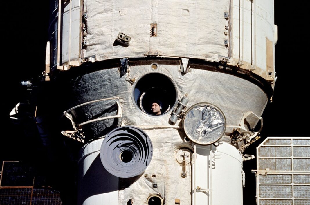 Cosmonaut Valery Polyakov, who was more than a year into his record-breaking 438-day mission, looks out the window of Russia