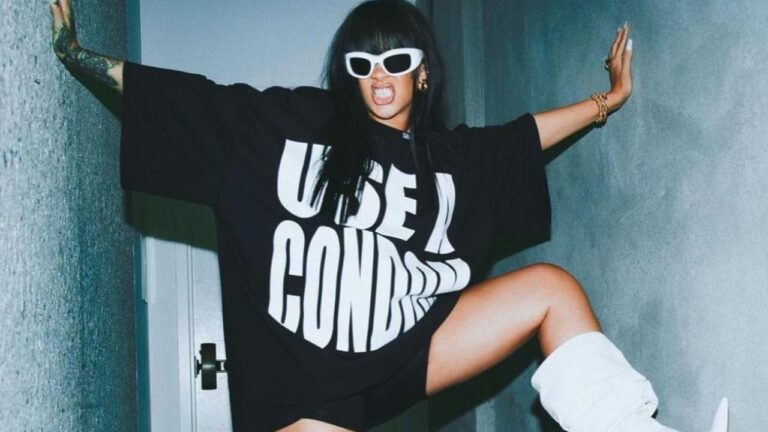 Rihanna Posed for the Gram in a Black Savage X Fenty “Wear A Condom” Shirt and White Amina Muaddi Boots