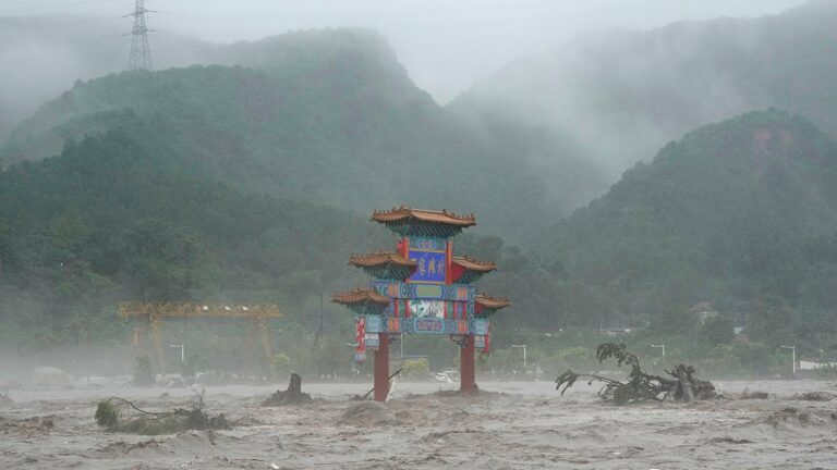 Thousands evacuated as Beijing flooding kills at least 20, leaves 27 others missing