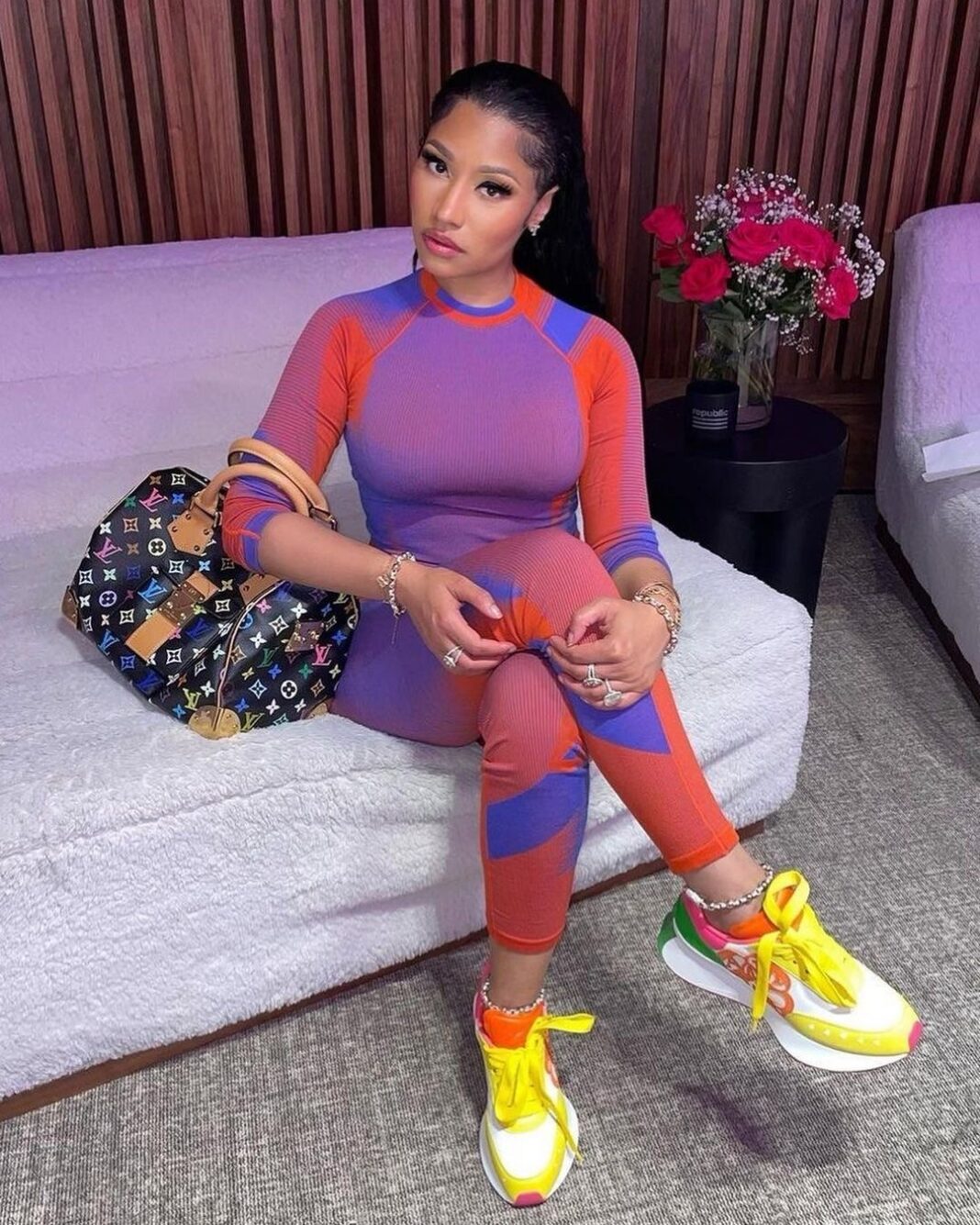 Nicki Minaj Wore a Red and Purple Y-3 Knit Set with $790 Alexander McQueen Color block Sneakers and a Louis Vuitton Murakami Handbag