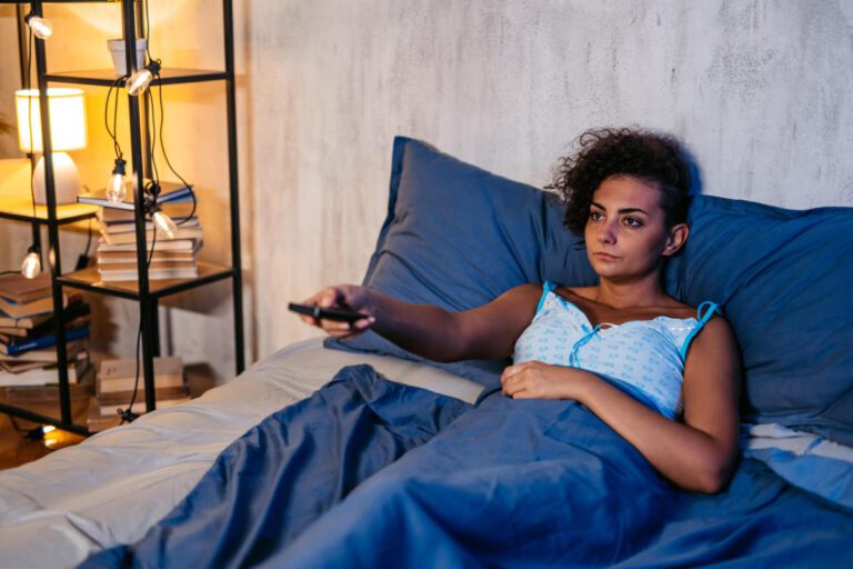 Do you fall asleep with the TV on every night? Here’s what experts say about the habit.