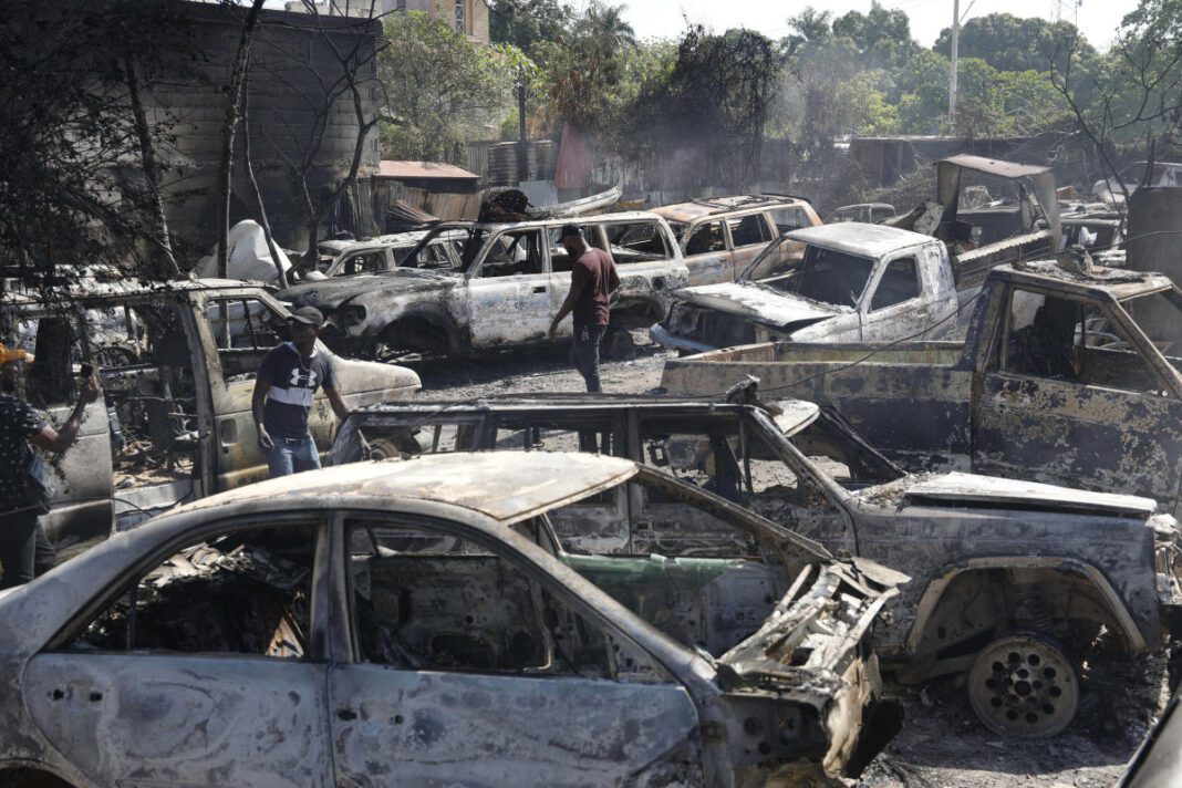 Police in Haiti say 2 men were hacked to death by a mob who thought they were buying ammo for gangs