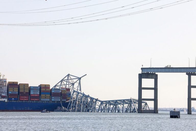 Salvage crews work to lift first piece of collapsed Baltimore bridge