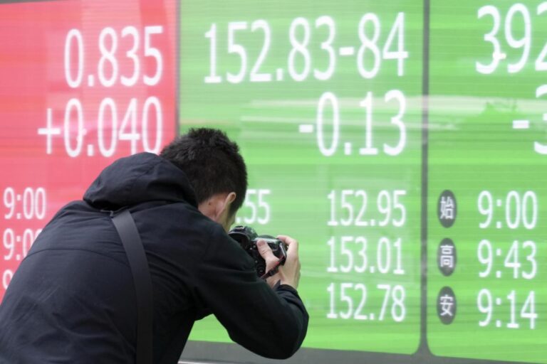 Asian shares are mixed, taking hot US inflation data in stride