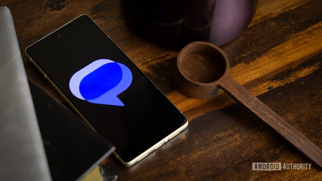 Google Messages logo on smartphone laying on table (1)